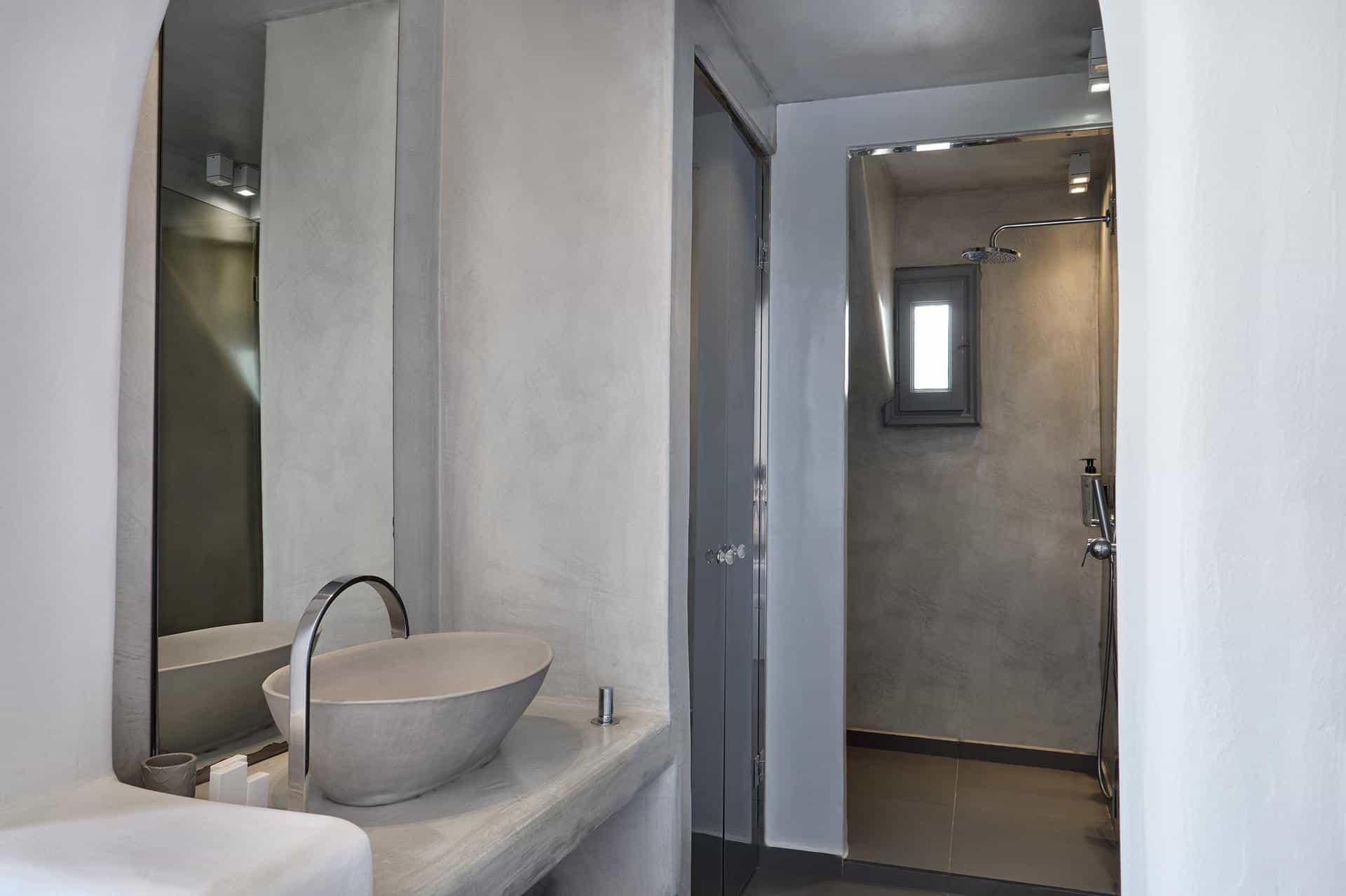 Cave suite bathroom with modern fixtures and stone textures