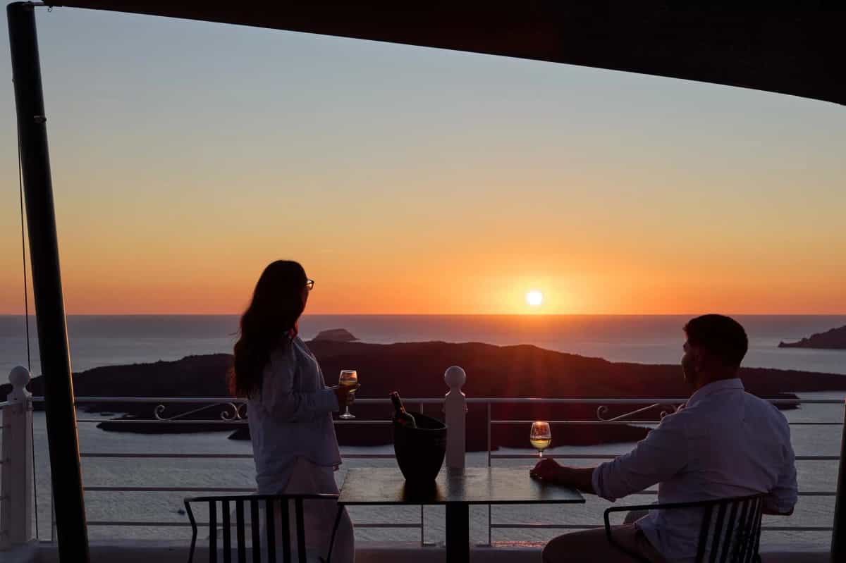 Evening caldera view with warm sunset tones from Fira