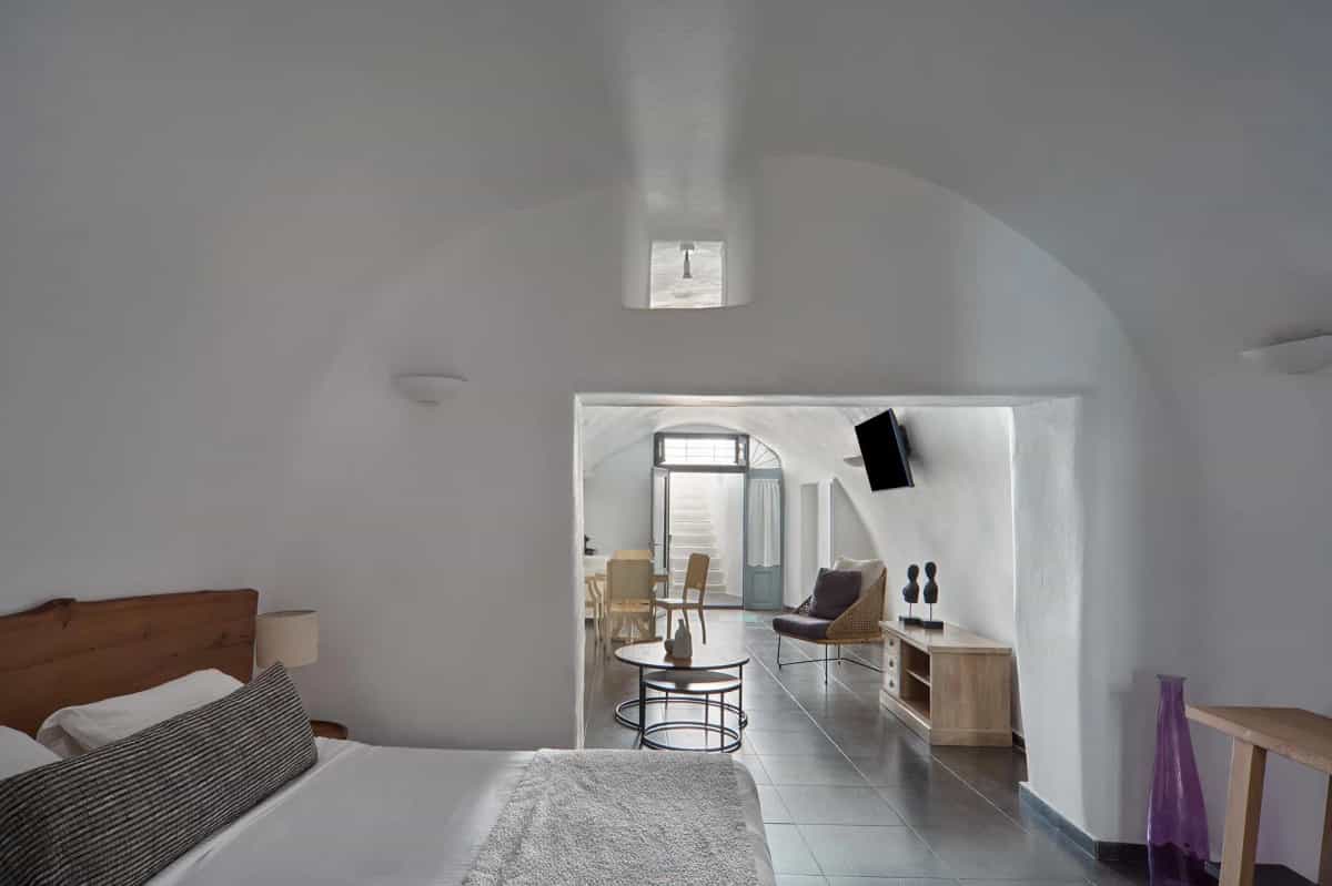 Spacious cave suite interior with arched ceiling and sitting area