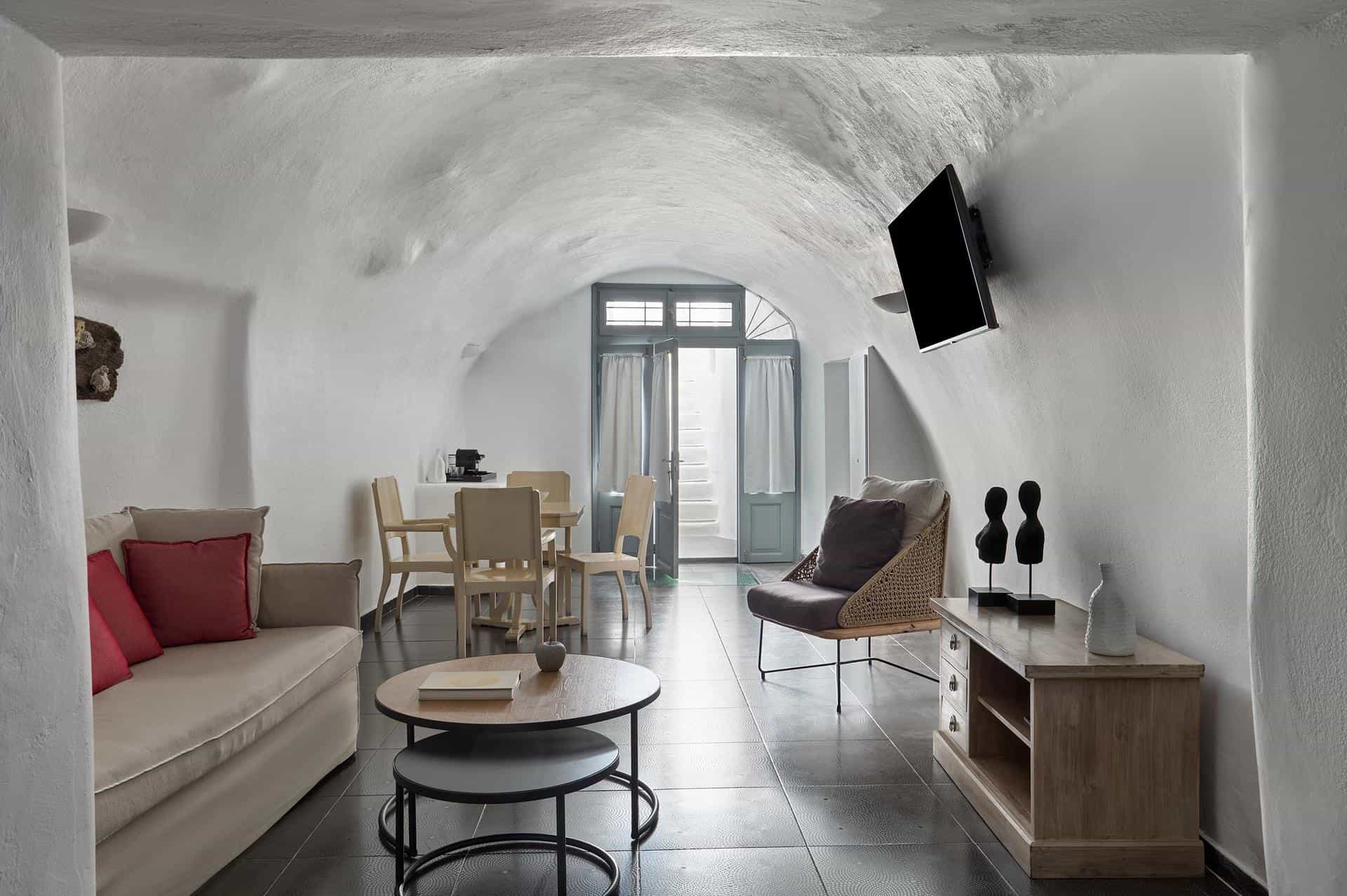 Suite bedroom with whitewashed walls and elegant furnishings