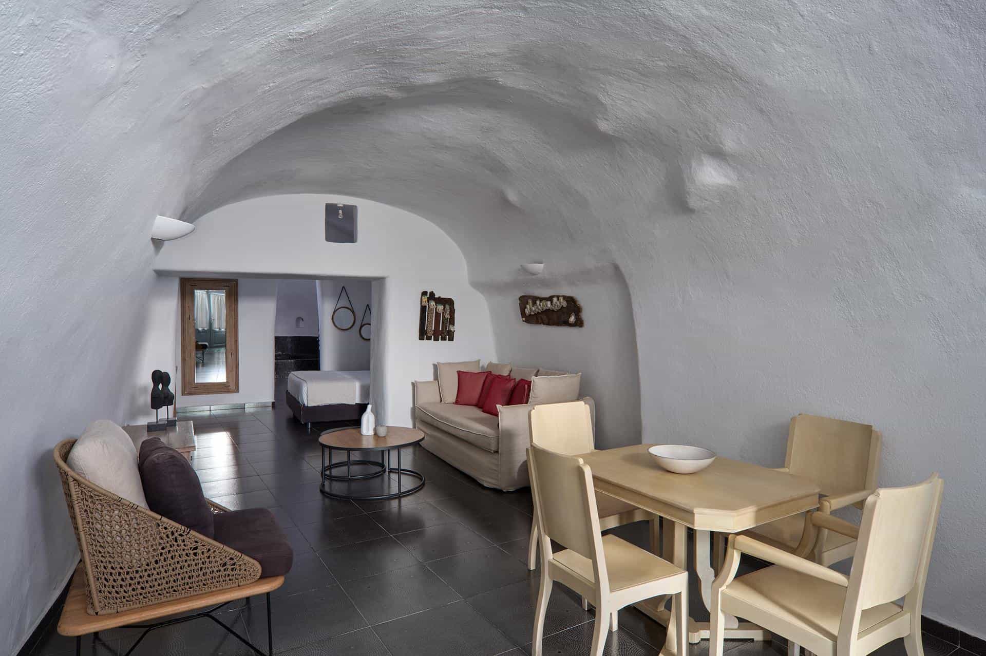 Suite bedroom with king-size bed and calming cave-style decor