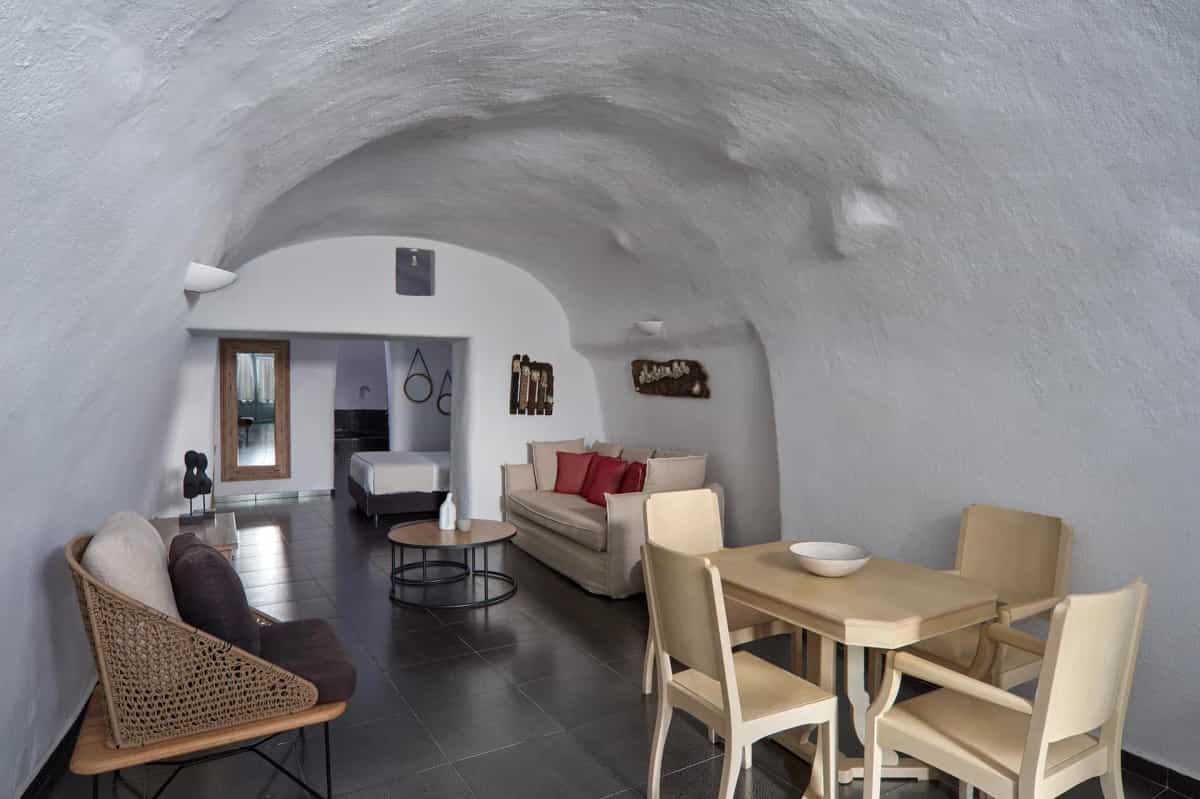 Suite bedroom with king-size bed and calming cave-style decor