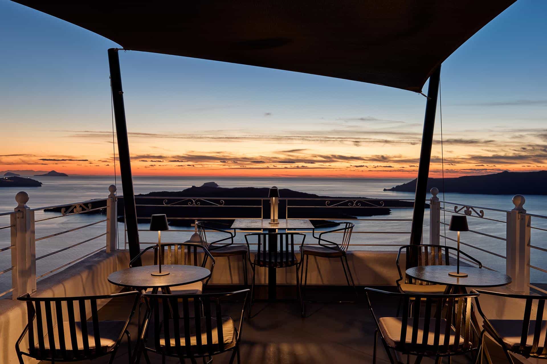 Vibrant sunset sky over the Santorini caldera and sea