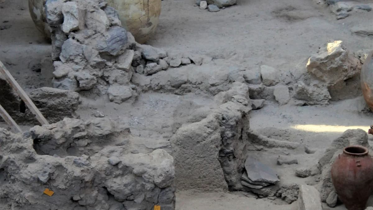 Ancient clay storage pots at the Akrotiri archaeological site in Santorini, preserved from the Bronze Age Minoan civilization