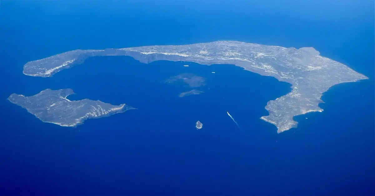 Aerial view of Santorini's ring of islands around the flooded caldera, Nea Kameni in the centre