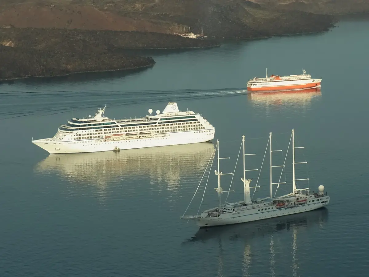Cruise ships anchored in the Santorini caldera, seen from Fira