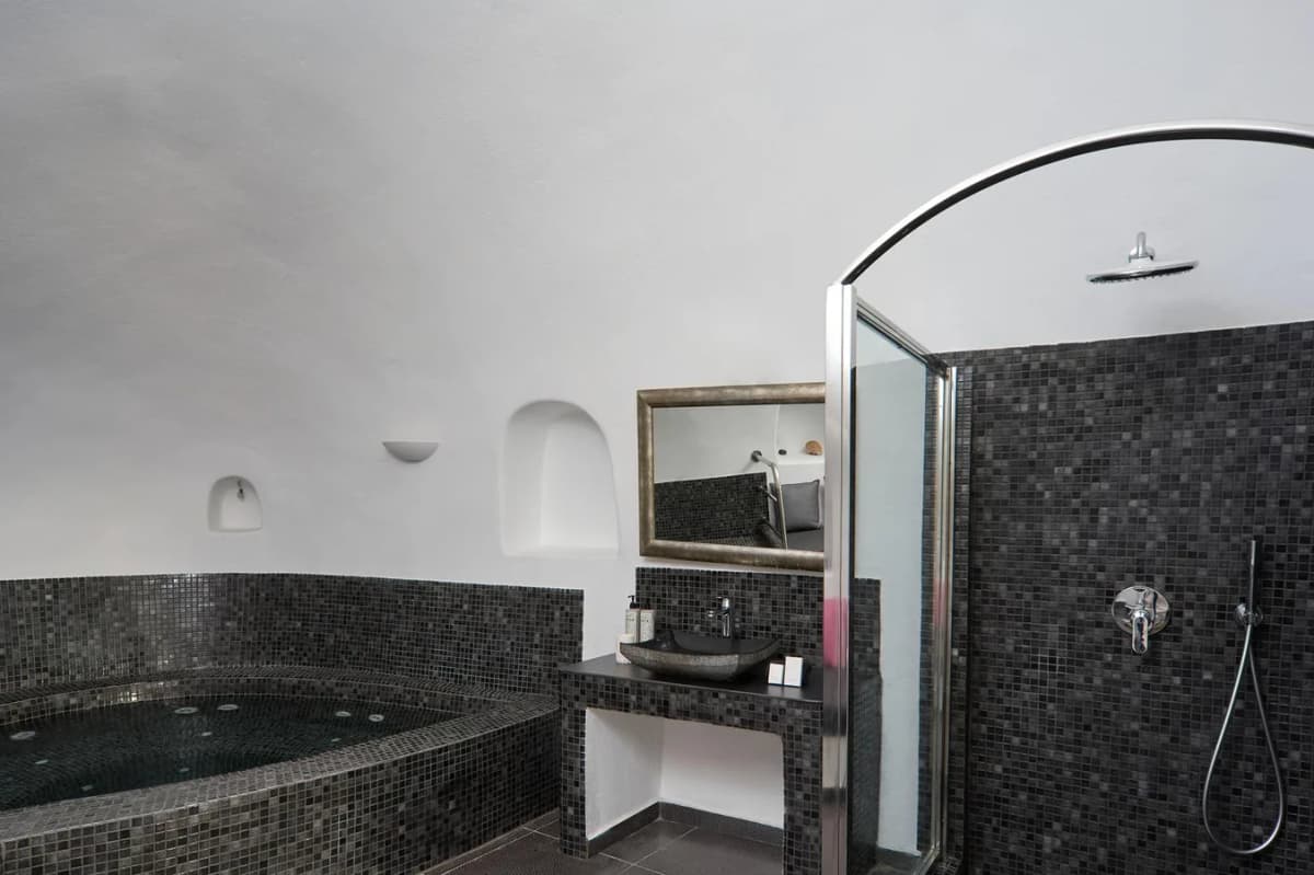 Private jacuzzi suite balcony at Aroma Suites with caldera view in Fira, Santorini