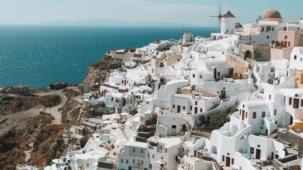 Whitewashed traditional architecture in a Santorini village with classic Cycladic buildings