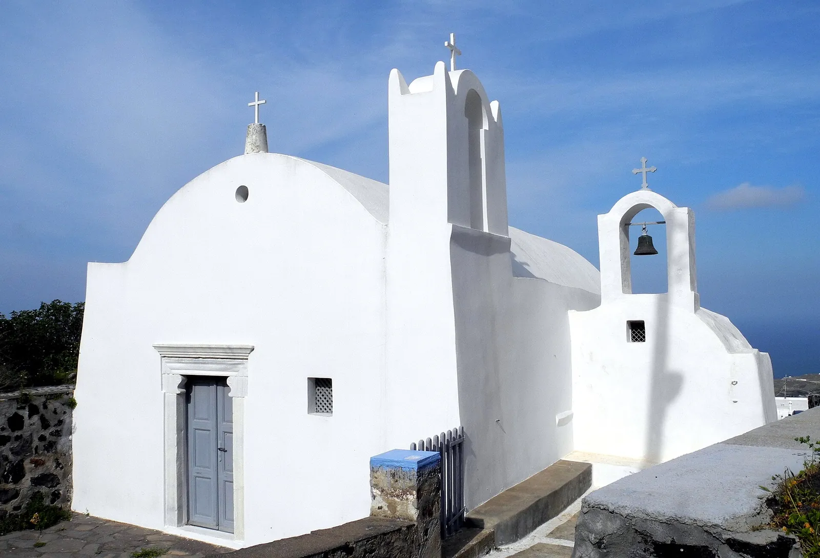 The whitewashed church of Agia Sofia in Firostefani with its bell gable