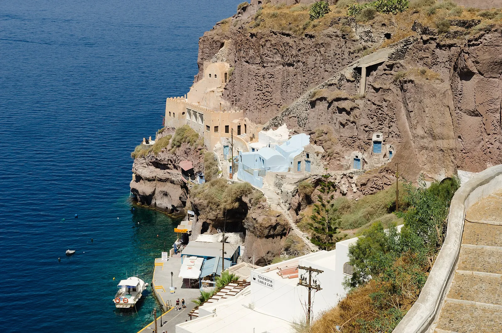 Old cave houses built into the cliff at Mesa Gialos, the old harbour below Fira