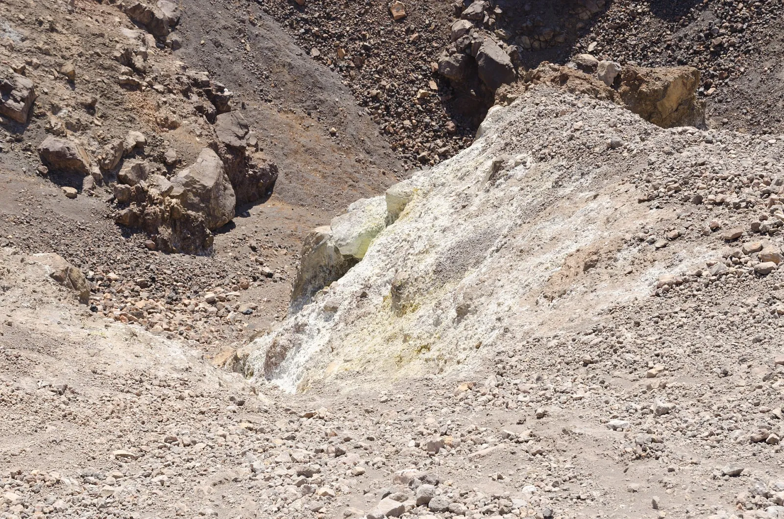 Sulfur deposits around a fumarole inside the crater of Nea Kameni, the volcanic island in the Santorini caldera