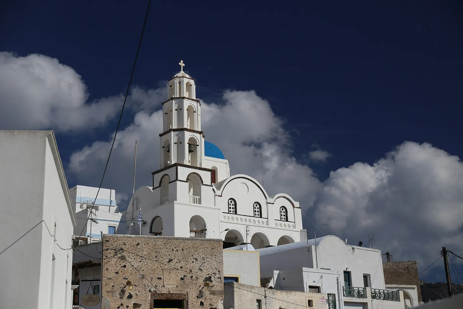 The church and bell tower of Pyrgos Kallistis above the village houses