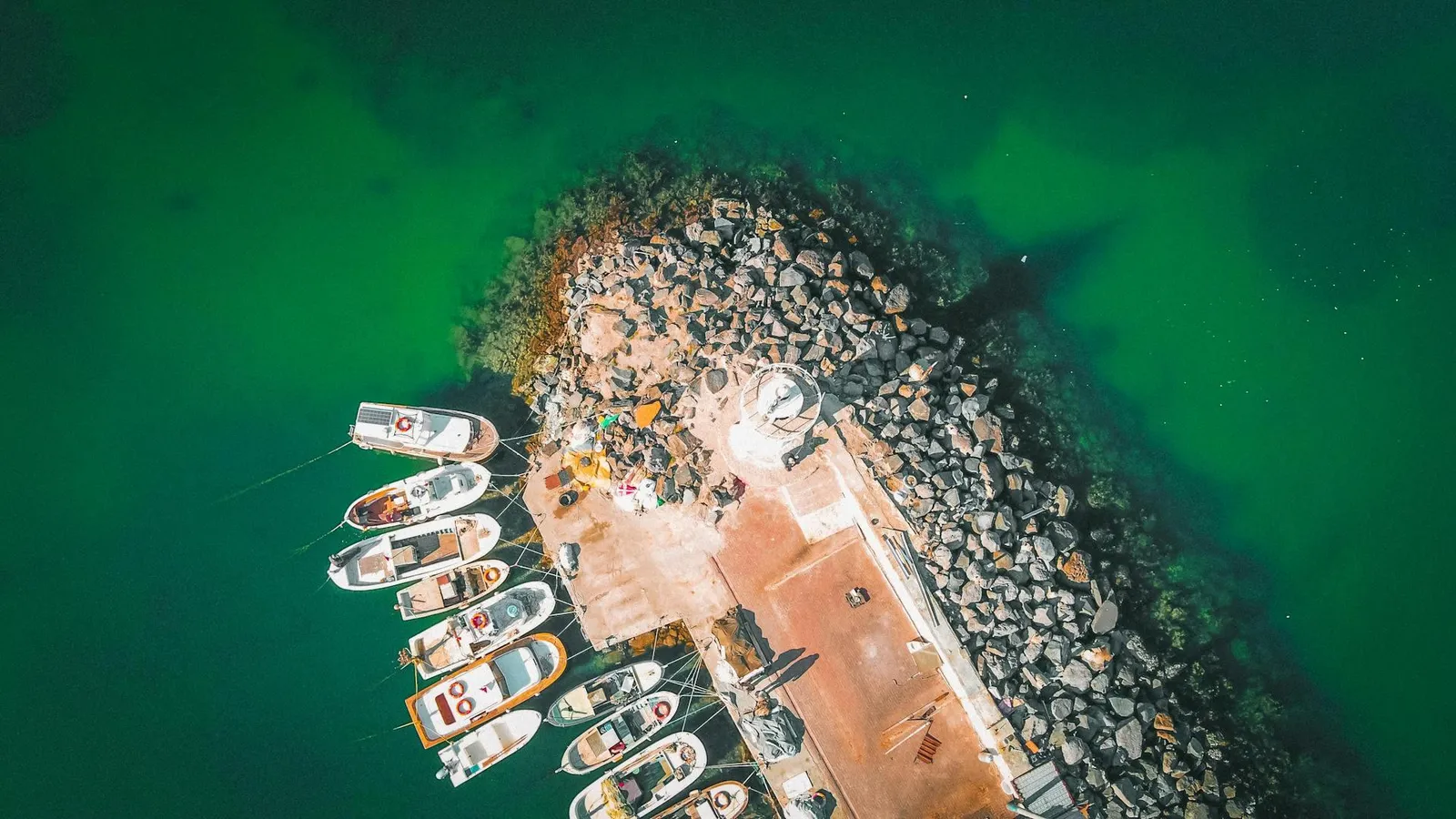 Cruise ship approaching Santorini with whitewashed caldera villages above