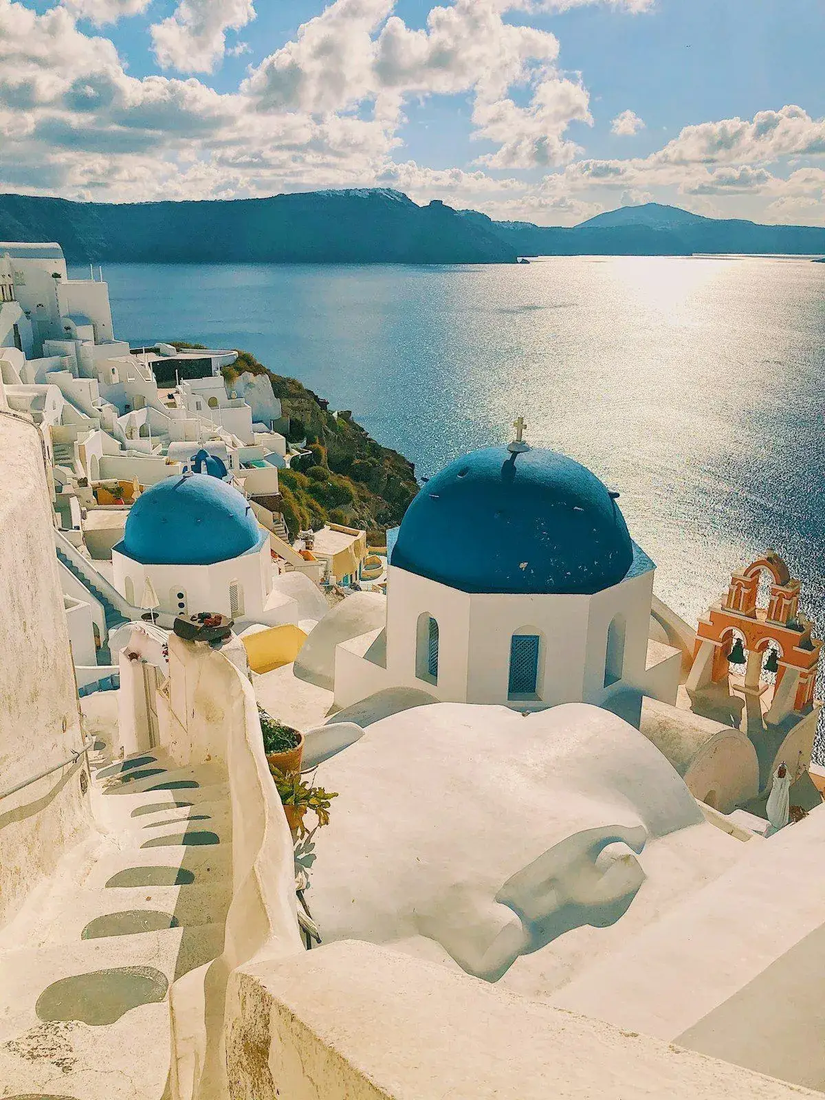 Stone steps winding through a traditional whitewashed village in Santorini